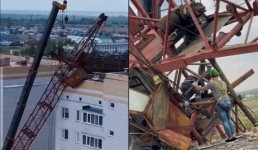 В Аксу сняли упавший на многоэтажку башенный кран